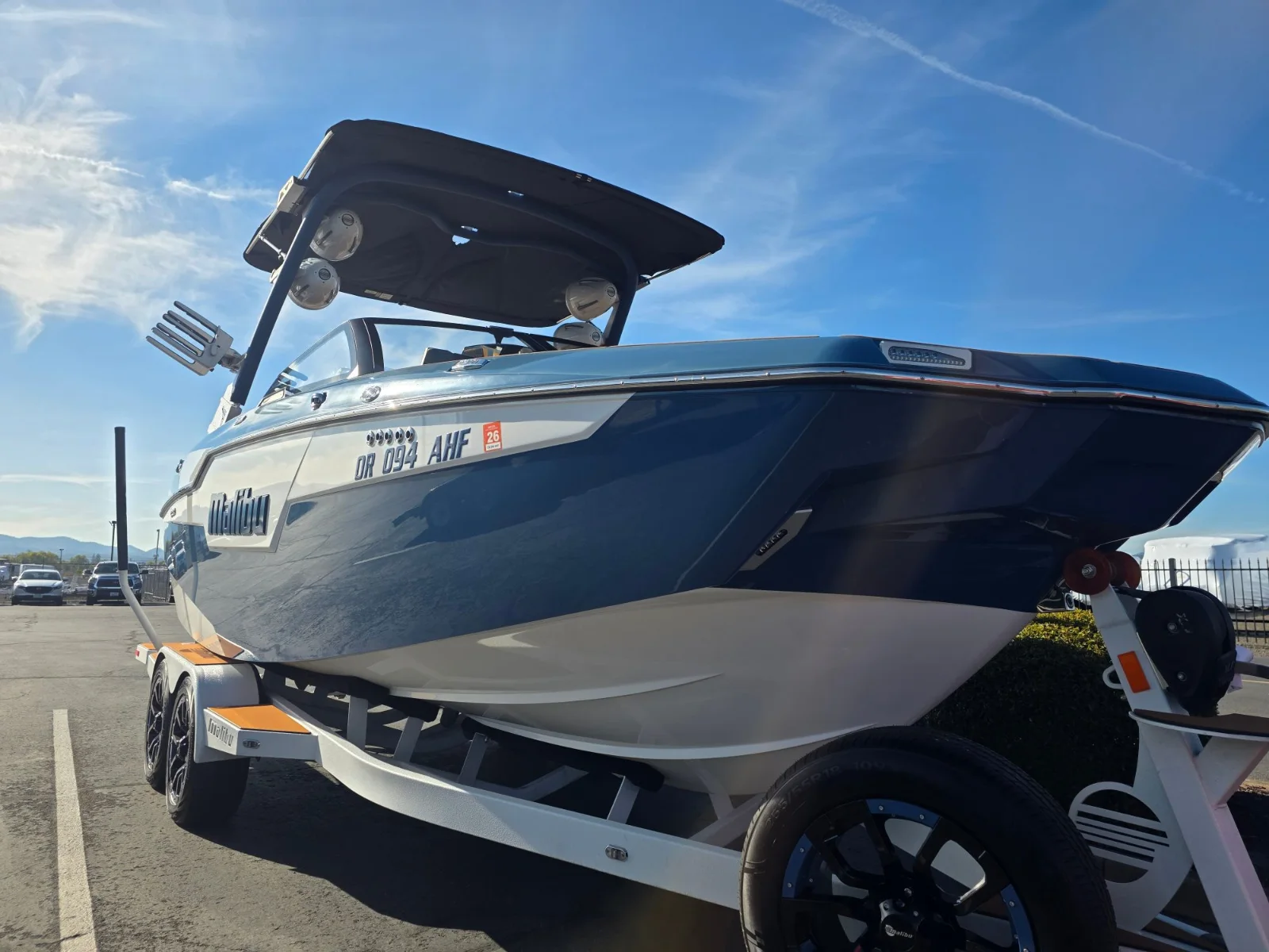 Gel coat correction stage on the white and blue 2021 Malibu m220 in Medford, Oregon.